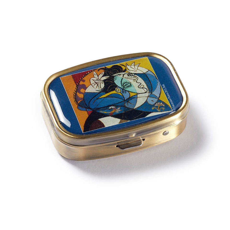 Pillbox.  Woman with arms raised by Picasso