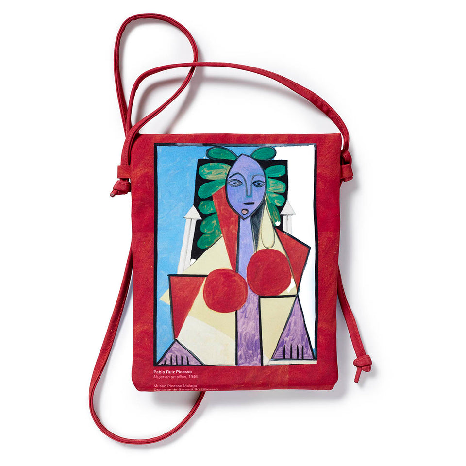 Bolso Bandolera Mujer en un sillón